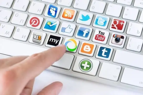 Kiev, Ukraine - May 20, 2013 - Hand pointing on keyboard with social media logotype collection of well-known social network brand's placed on keyboard buttons. Include Facebook, YouTube, Twitter, Google Plus, Instagram and more other logos.