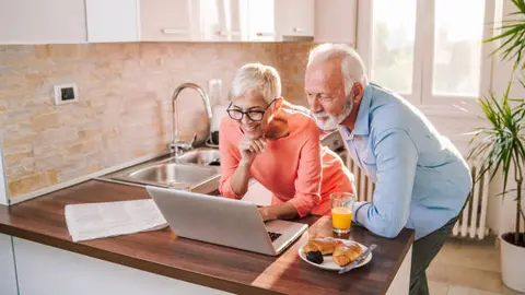 Senior couple, wife and husband shopping online