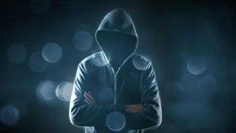 Cybersecurity, computer hacker with hoodie